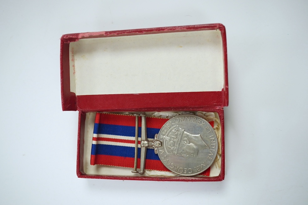 An assortment of WWI interest and other medals and related matter to include badges and brooches, some with enamel, housed in a domed box, together with two swagger sticks, Condition - mostly fair